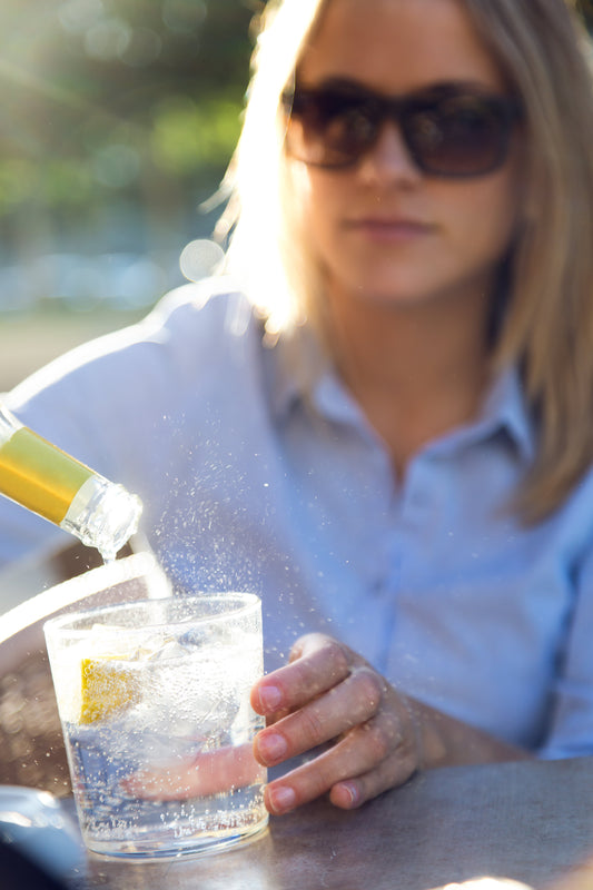 woman drinking gin and questioning if it is good for you