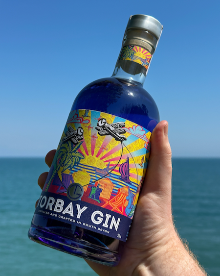 Torbay gin English Riviera Airshow in hand with sky background